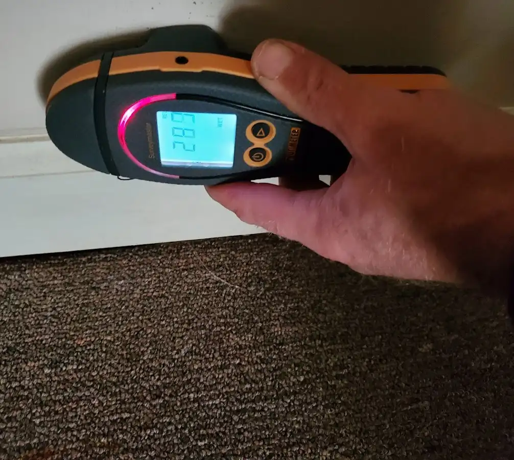Moisture detection at baseboard during Storm Damage Restoration in Wethersfield